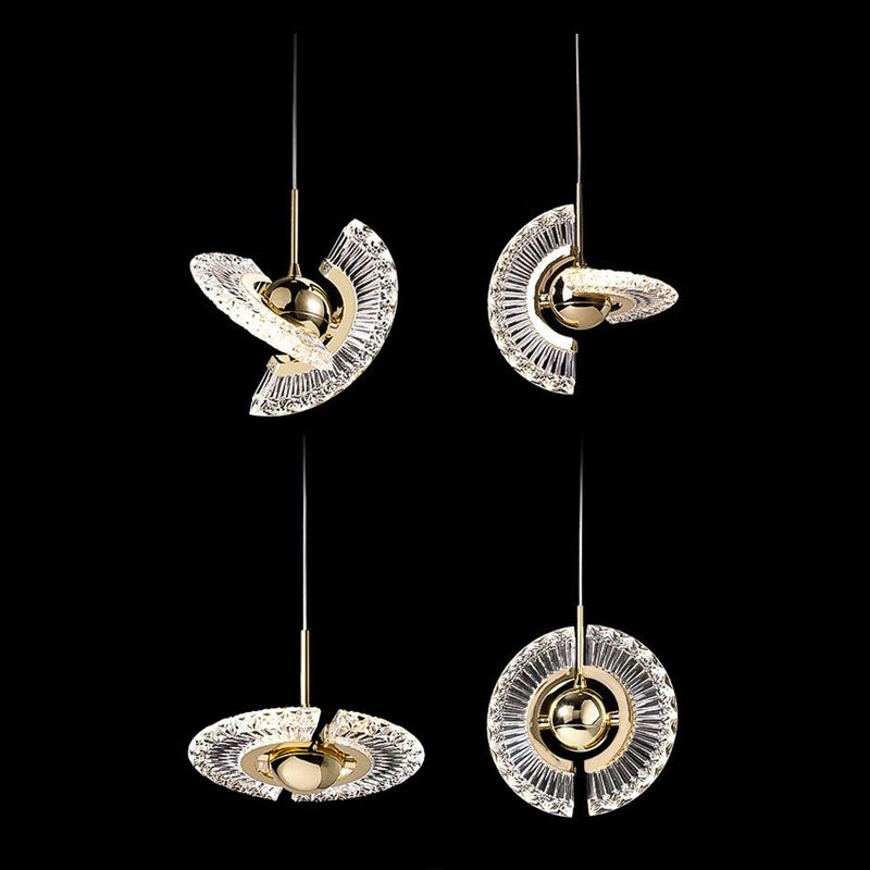 Elegant gold pendant light with clear glass shade, perfect for dining room decor.