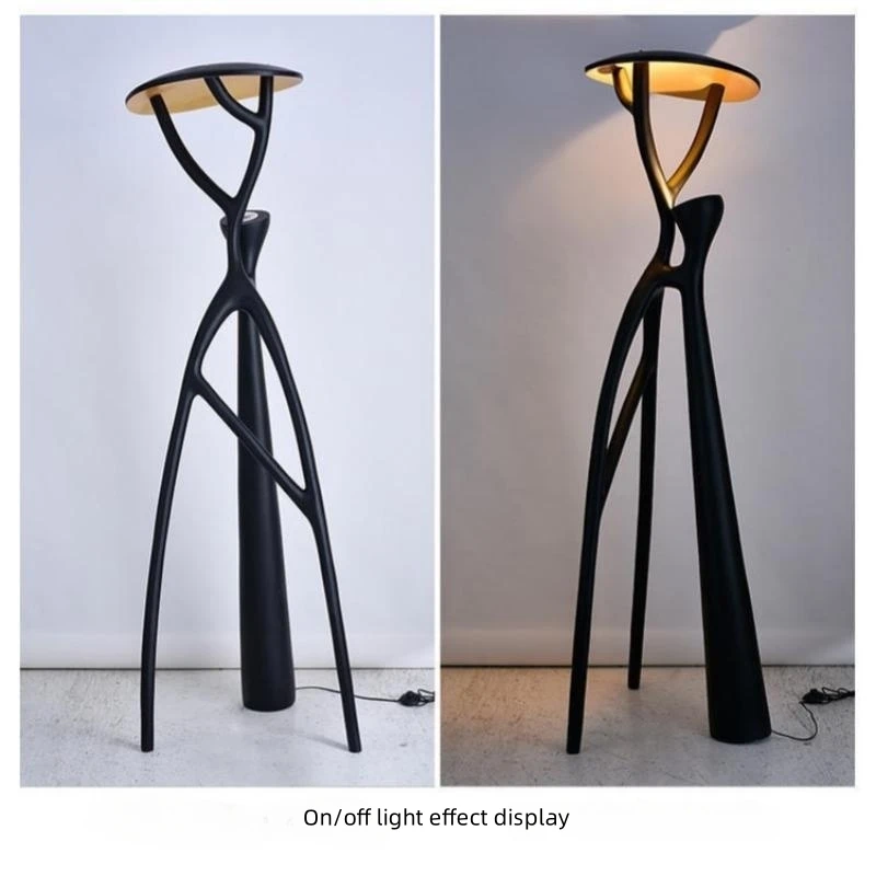 Elegant black LED floor lamp in a cozy living room setting, showcasing its stylish design.