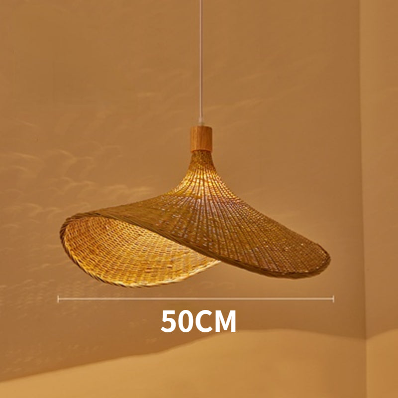 Eco-Chic Bamboo Wicker LED Pendant Light from a side angle in a cozy living room setting.