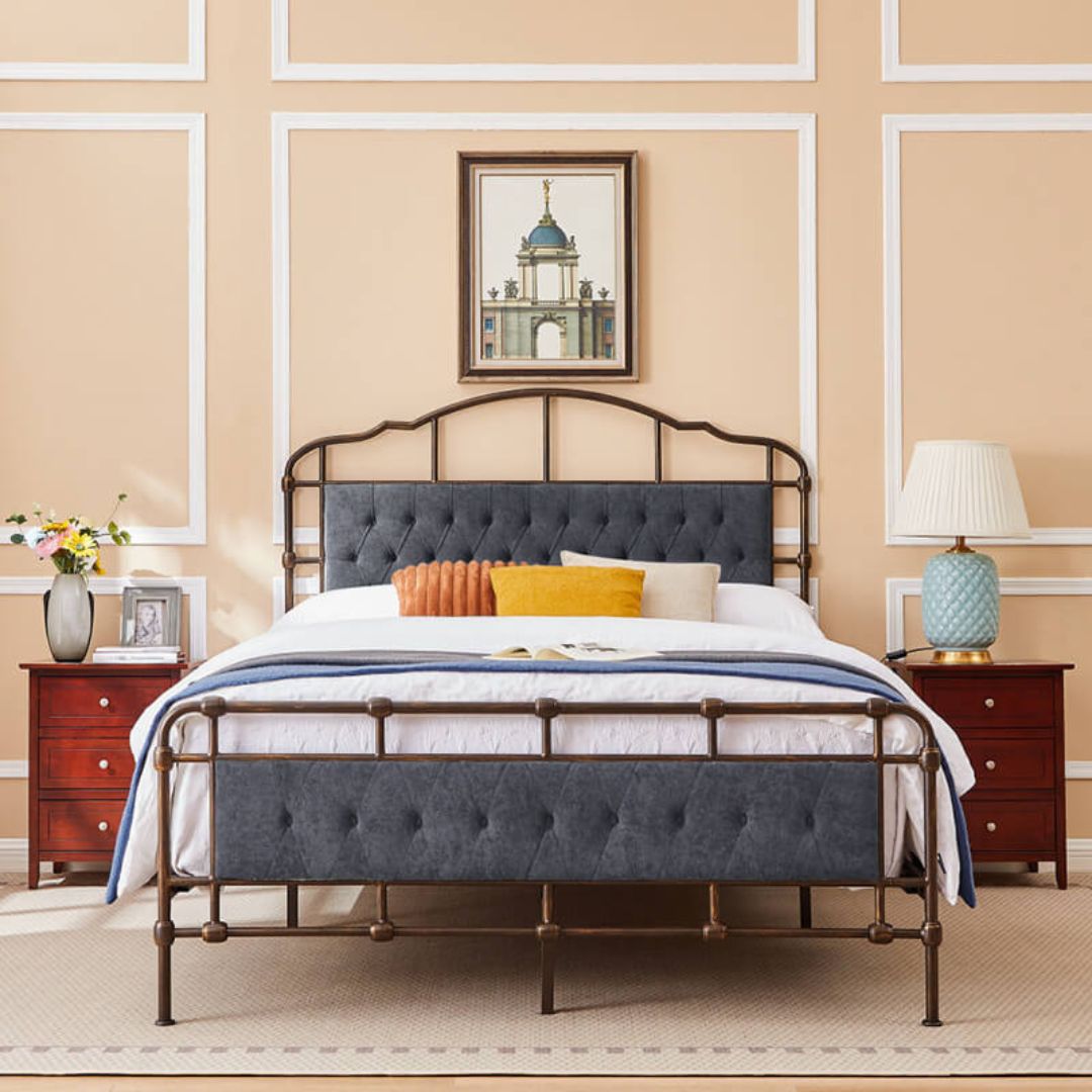 Luxurious dark grey metal bed frame with velvet upholstery from the side view.