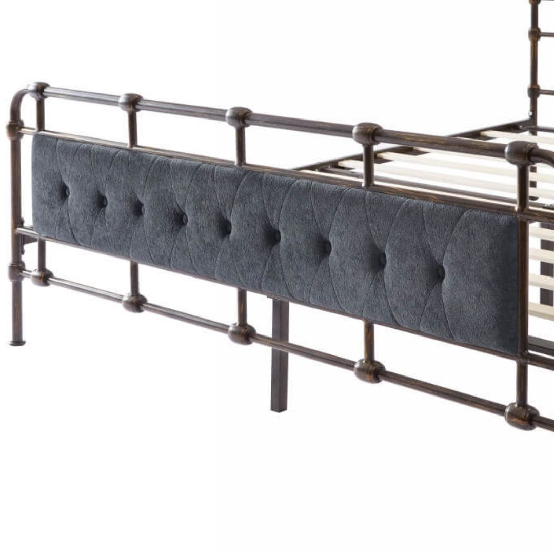 Luxurious dark grey metal bed frame with velvet upholstery from the side view.
