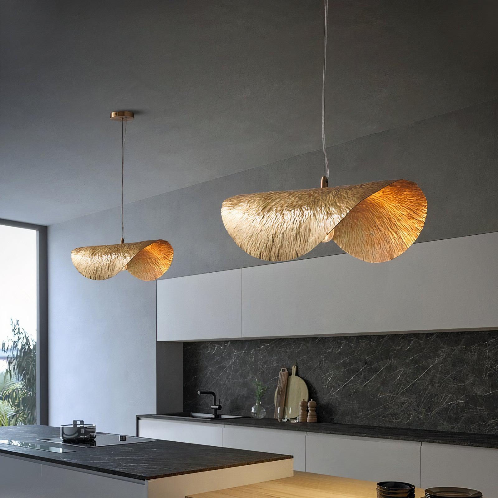 Elegant copper pendant light showcasing a lotus leaf design from an angle, perfect for dining rooms.