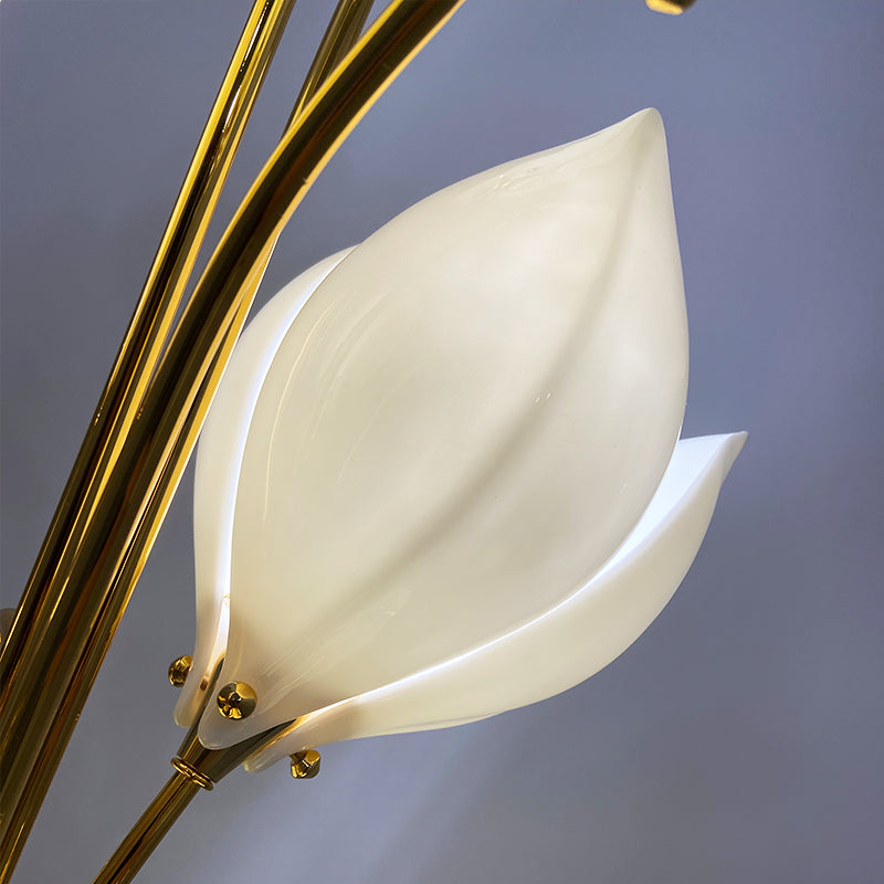 Ceramic magnolia flower lamp illuminating a cozy restaurant table setting