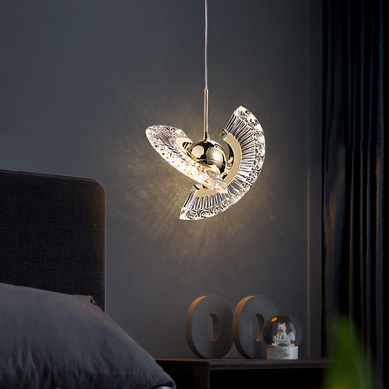 Elegant gold pendant light with clear glass shade, perfect for dining room decor.