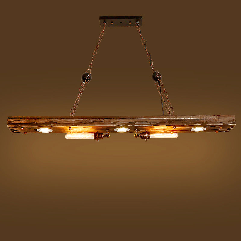 Heritage Glow pendant light hanging above a cozy reading corner featuring rustic furniture