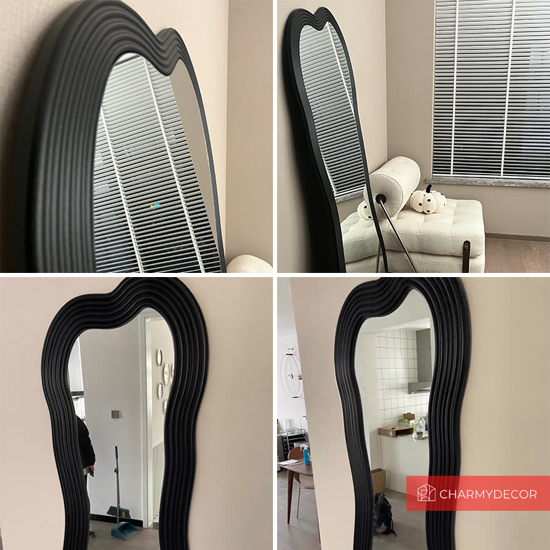 Irregular floor mirror positioned elegantly in a minimalist hallway for functional decor.