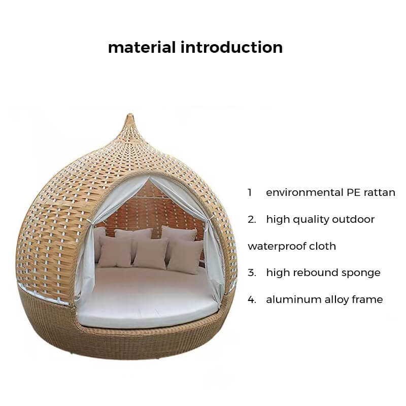 Rattan birdcage daybed sofa set up on a hotel balcony for outdoor relaxation.
