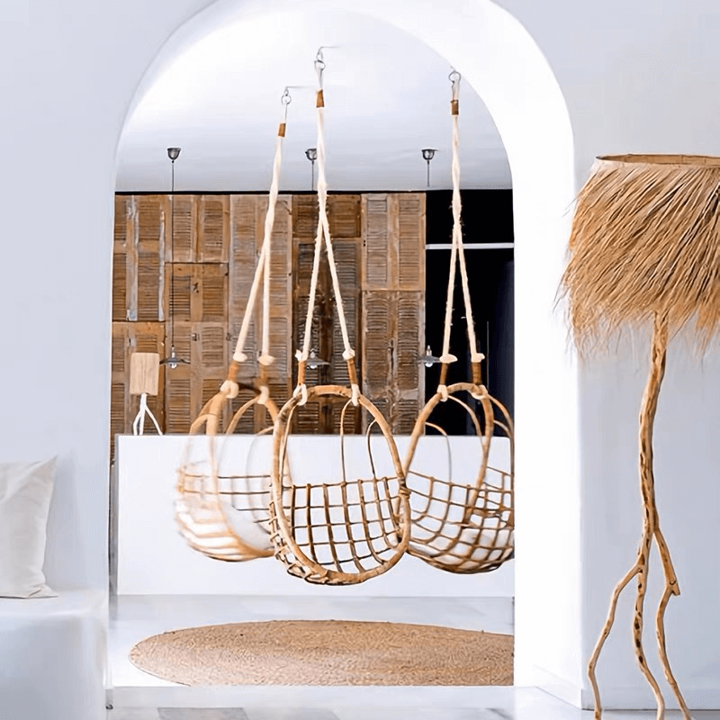Close-up of the rattan chairs texture and cushion, ideal for outdoor lounging.