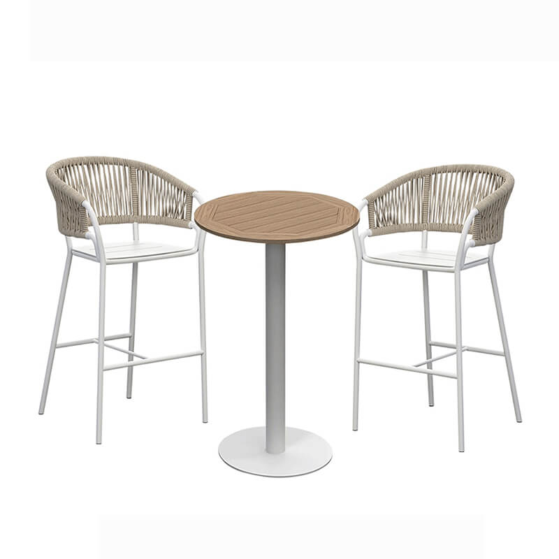 Full view of rattan high bar table set ready for outdoor dining.