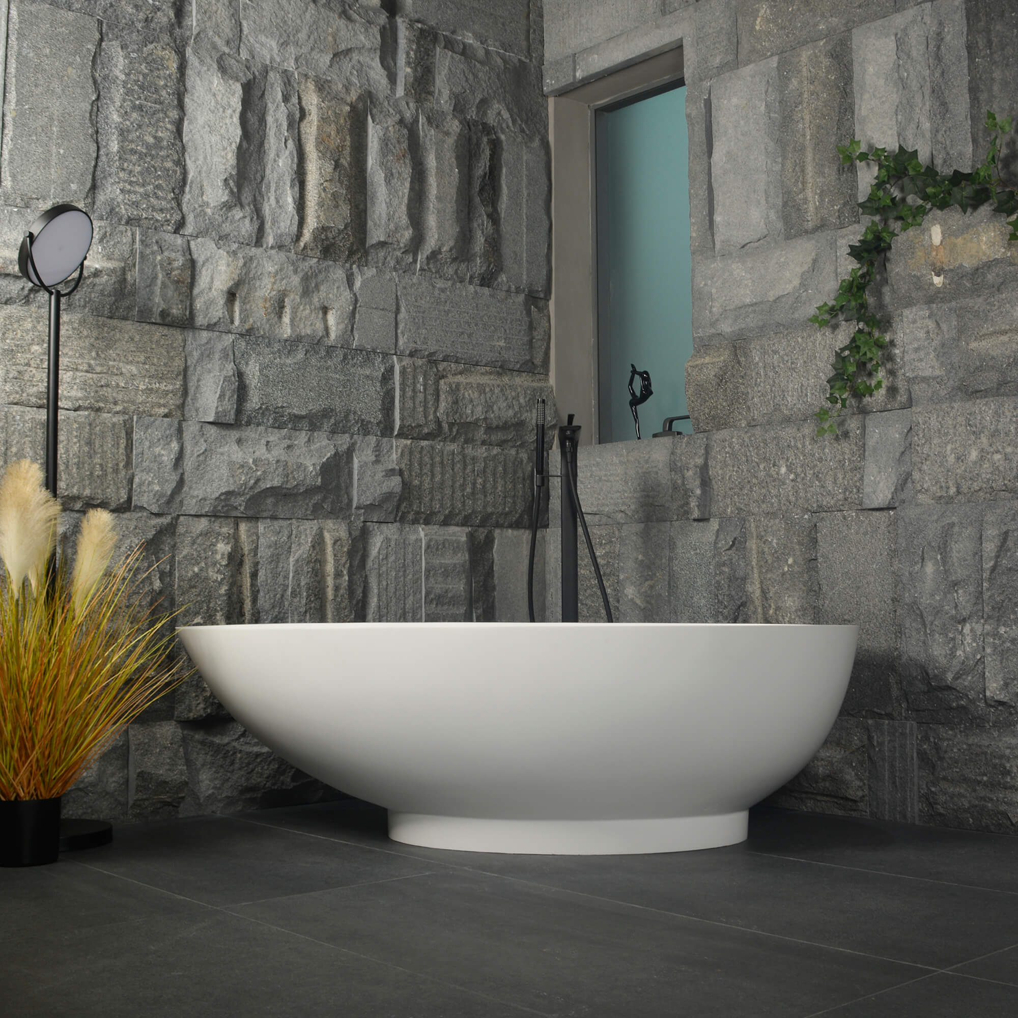 Side view of the freestanding bathtub in a stylish bathroom setting, highlighting its versatility.