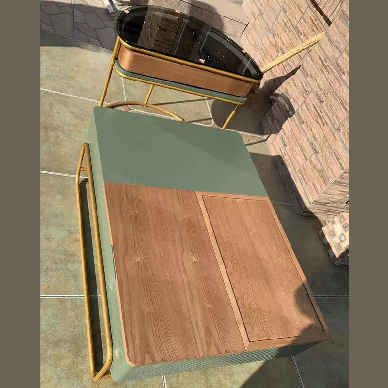 The bottom shelf of the modern coffee table displaying decorative items.
