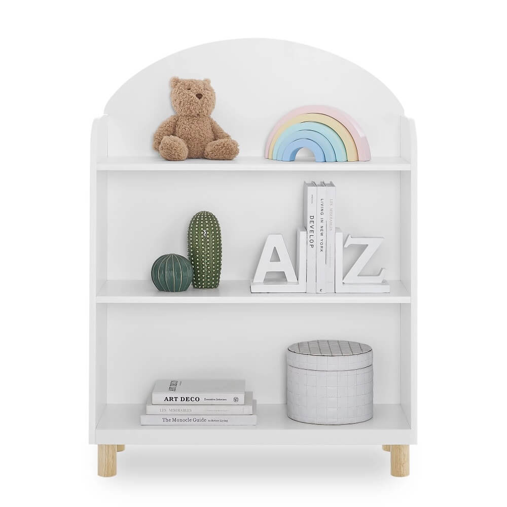 Reese Modern Kids Bookcase in a bright bedroom setting showcasing three shelves filled with colorful childrens books.