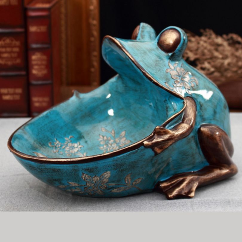 Decorative frog sculpture in calming green and blue hues, perfect for retro decor.