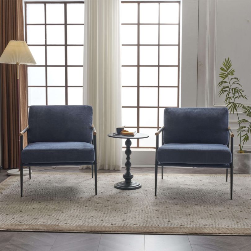 Close-up of the chenille fabric on the stylish blue armchair, demonstrating its plush texture and retro aesthetic.
