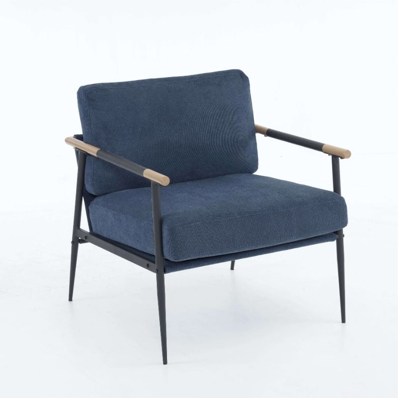 Side angle of the comfortable armchair with metal frame, highlighting its elegant design in a cozy living room setting.