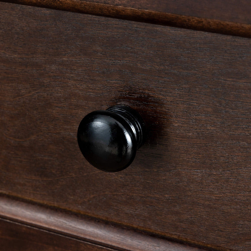 Close-up of the antique auburn finish on the wooden furniture, highlighting its craftsmanship.