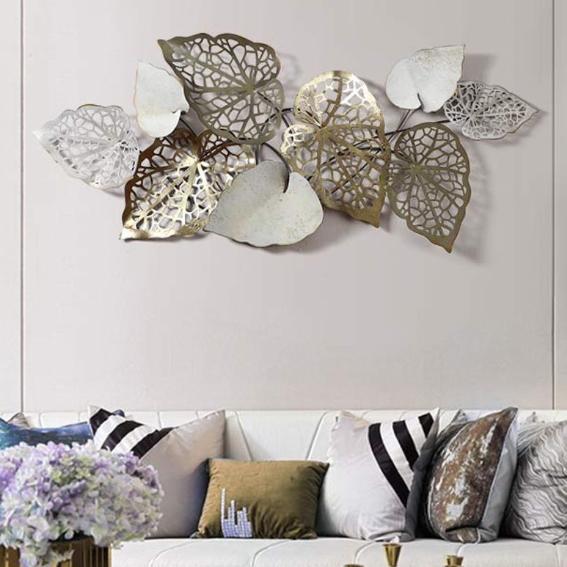 Chic retro 3D iron leaf wall art displayed in a living room setting, showcasing its elegant design.
