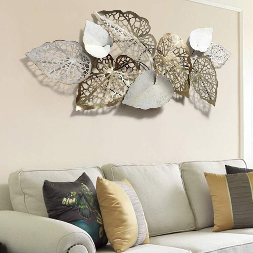 Installation process of the retro iron wall art, showing the built-in hook for easy hanging.