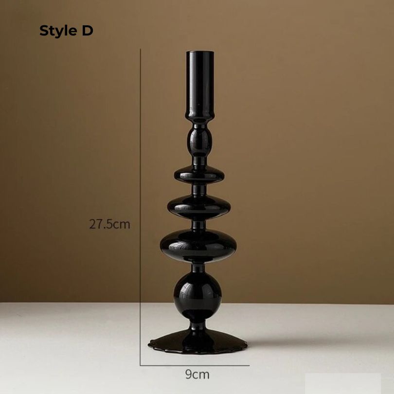 Elegant retro black glass candle holder on a beautifully set dinner table.