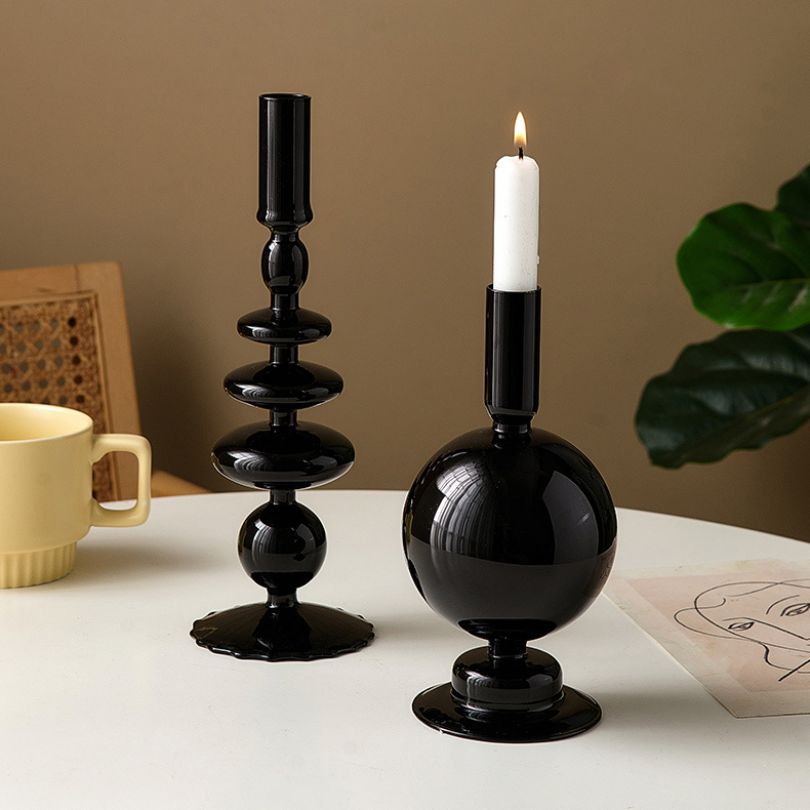 Close-up view of the retro candle holder showcasing its sleek black glass design.