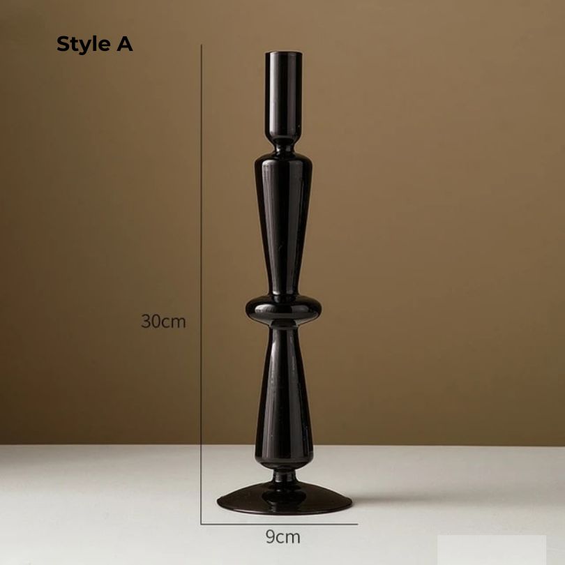 Elegant retro black glass candle holder on a beautifully set dinner table.