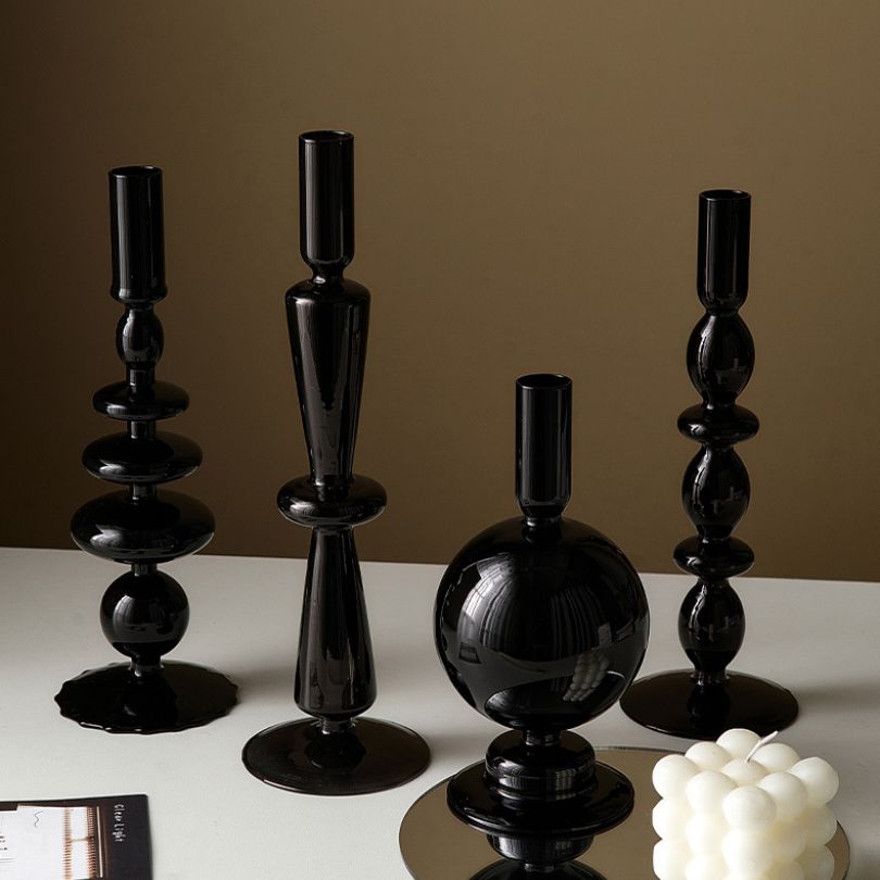 Close-up view of the retro candle holder showcasing its sleek black glass design.