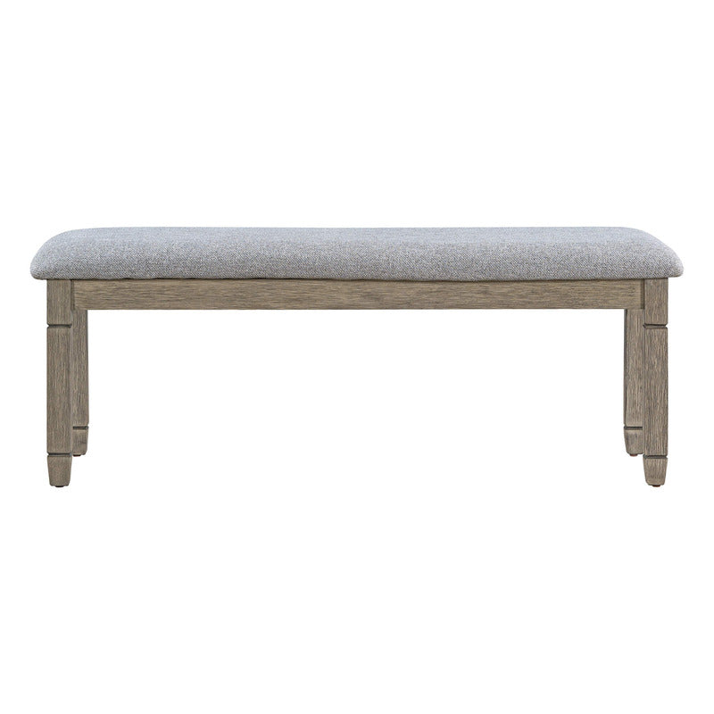 Comfortable upholstered chairs and dining bench in a stylish dining setup.