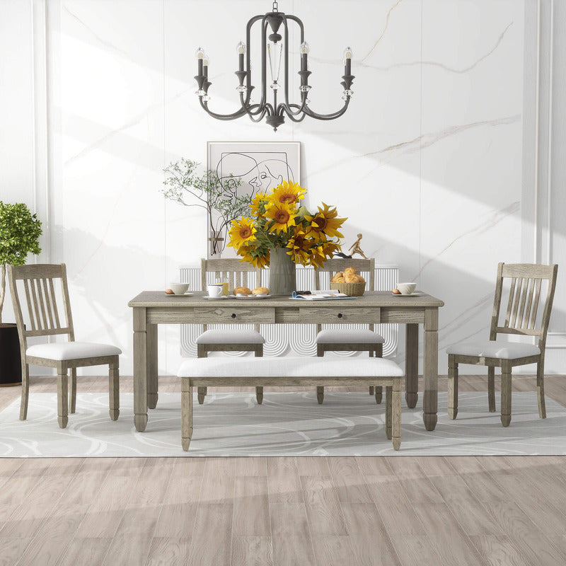 Close-up of the grey rectangular dining table with four drawers and tapered legs.