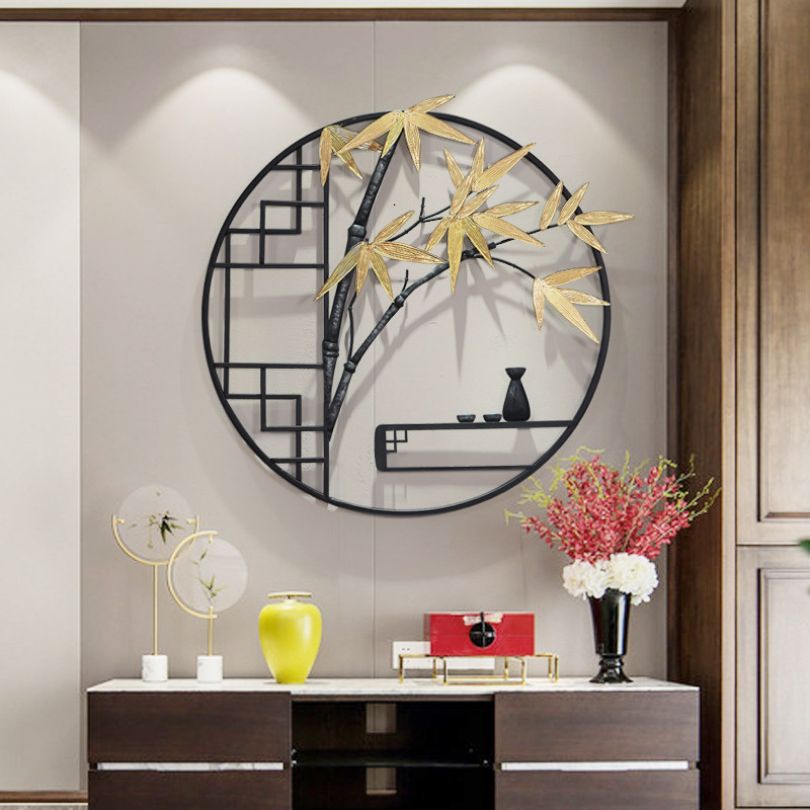 The metal tree wall art displayed in a cozy living room setting, adding a touch of sophistication.