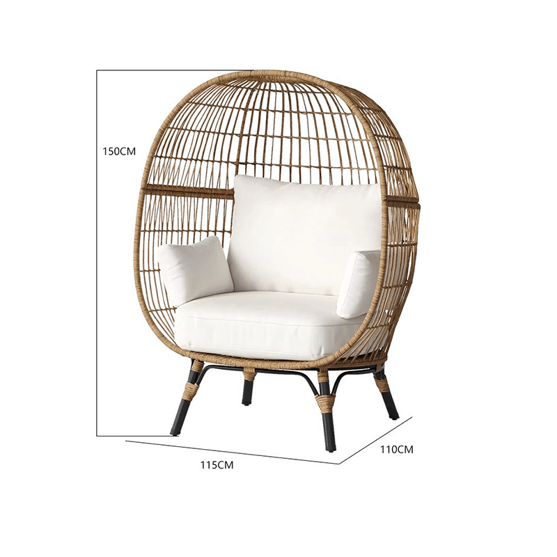 Natural setting featuring the Retro Ventura Wicker Patio Chair surrounded by greenery.
