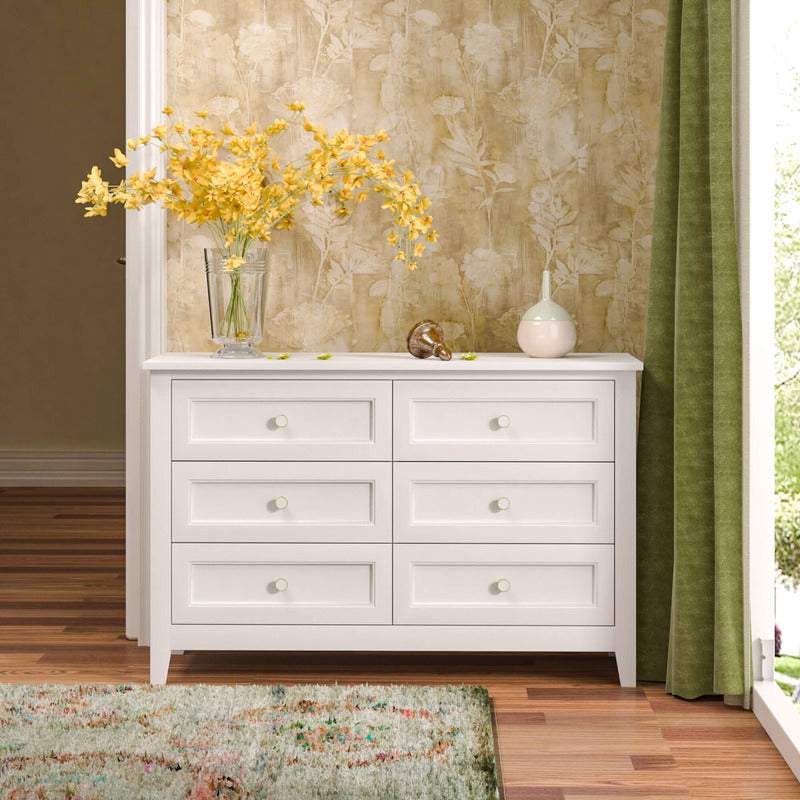 Side angle view of the storage cabinet displaying its spacious drawers and vintage round handles.