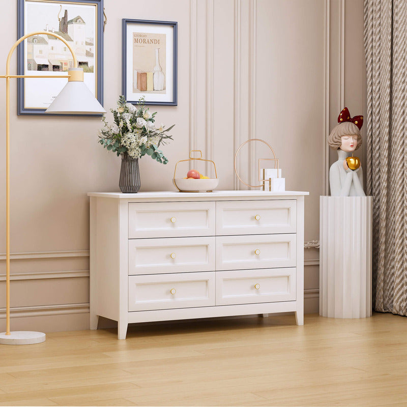Close-up of the cabinets vintage round handle and smooth white finish, highlighting its quality.