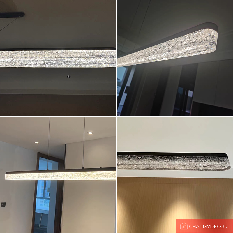 Sleek modern LED pendant light showcased above a contemporary dining table.