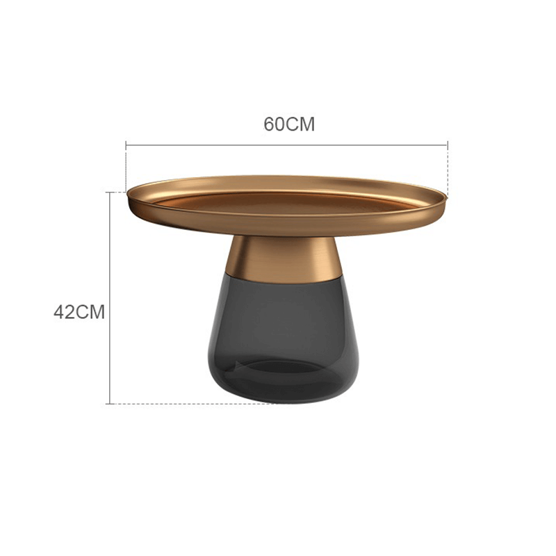Modern round glass coffee table showcasing its clear surface in a contemporary living room.