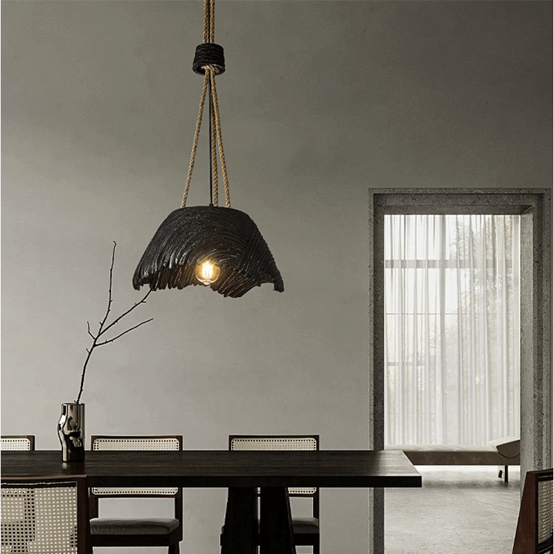 Rustic hemp rope pendant lamp showcased in a modern dining room.