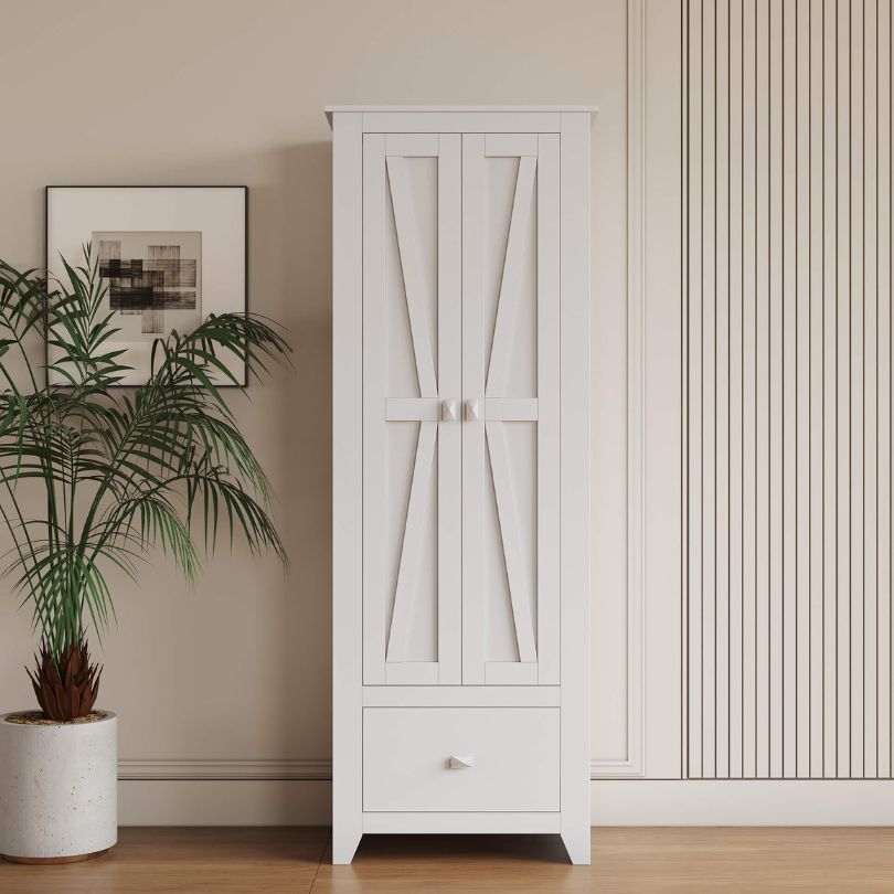 Front view of the rustic white storage cabinet with barn doors, showcasing its spacious drawers.