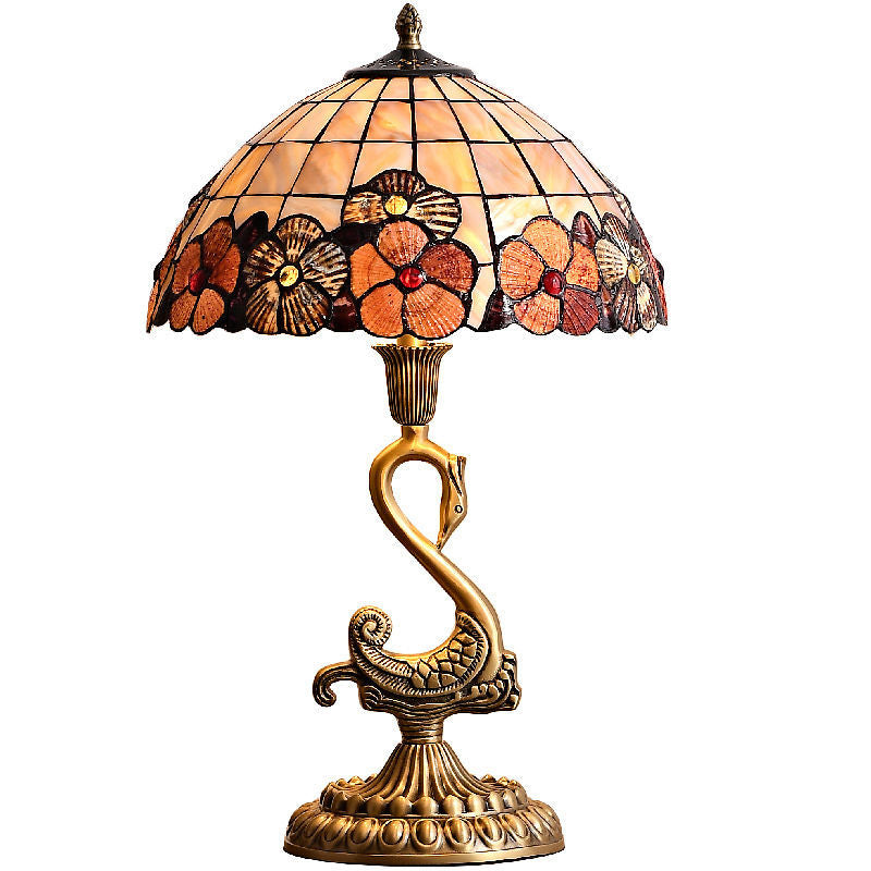 Elegant Swan Brass Table Lamp showcasing its unique design and copper base from a side angle.