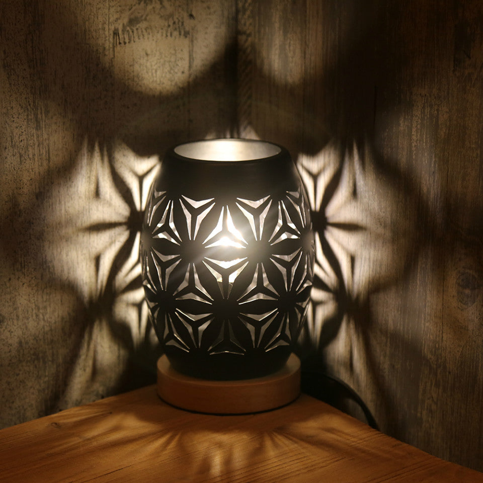 Elegant black LED decorative lamp illuminating a cozy reading nook, highlighting its soft light.