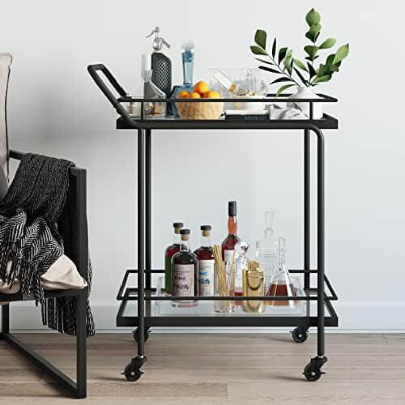 Sleek metal rolling bar cart with glass shelves in a stylish kitchen setting