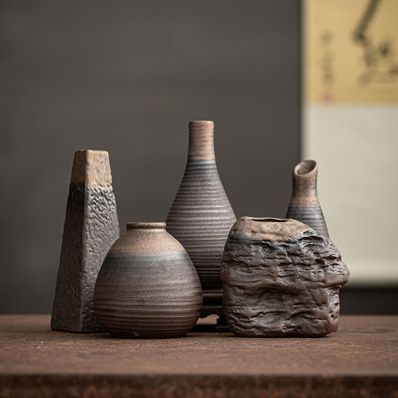 Artisan crafted antique ceramic vase in dark grey, perfect for home decor.