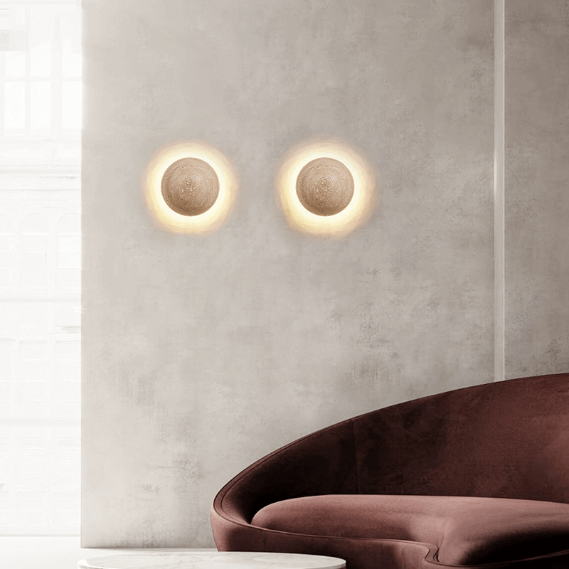Elegant cave stone LED wall light showcasing the warm glow in a cozy living room setting.
