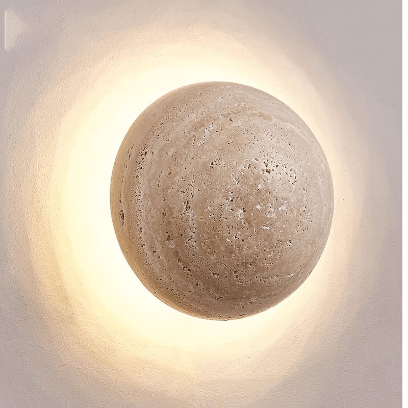 Elegant cave stone LED wall light showcasing the warm glow in a cozy living room setting.