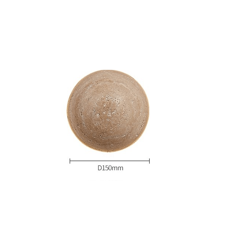 Close-up view of the travertine stone texture of the LED wall light, highlighting its unique character.