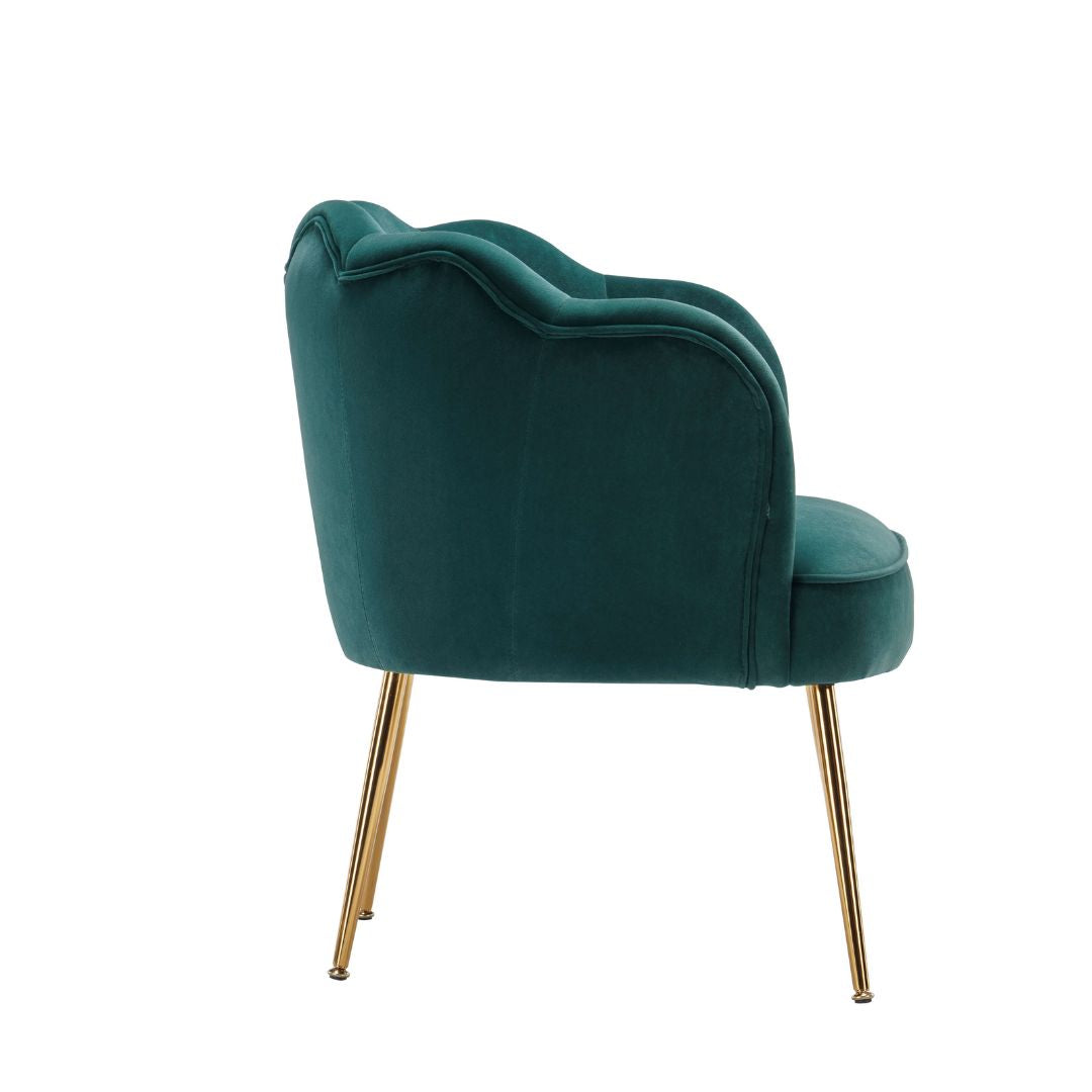 Close-up of the luxurious dark green velvet fabric and gold leg detail.