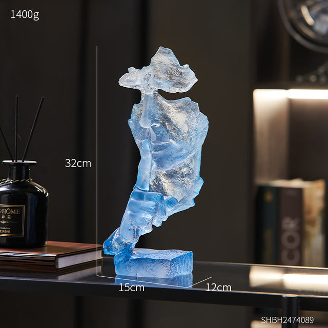 Silent Mask sculpture on a stylish office desk, enhancing the modern decor of the space.