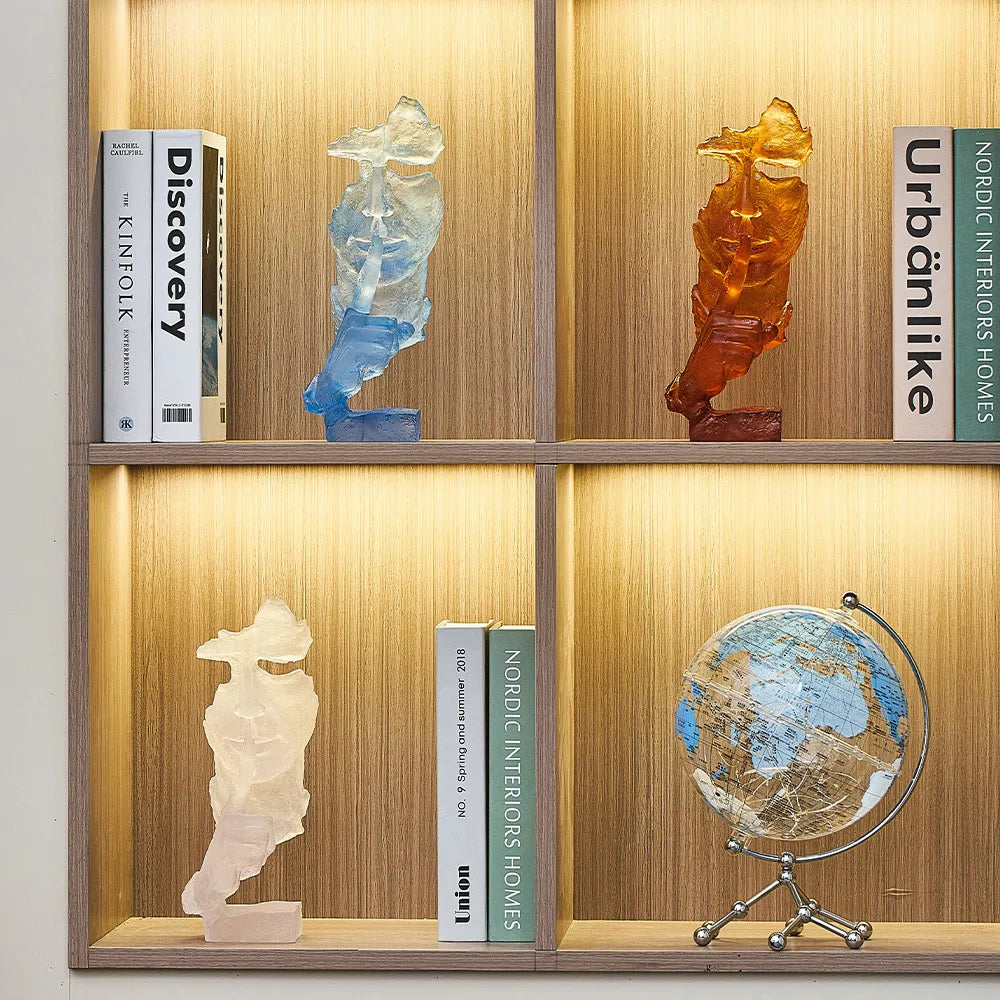 Silent Mask sculpture on a stylish office desk, enhancing the modern decor of the space.