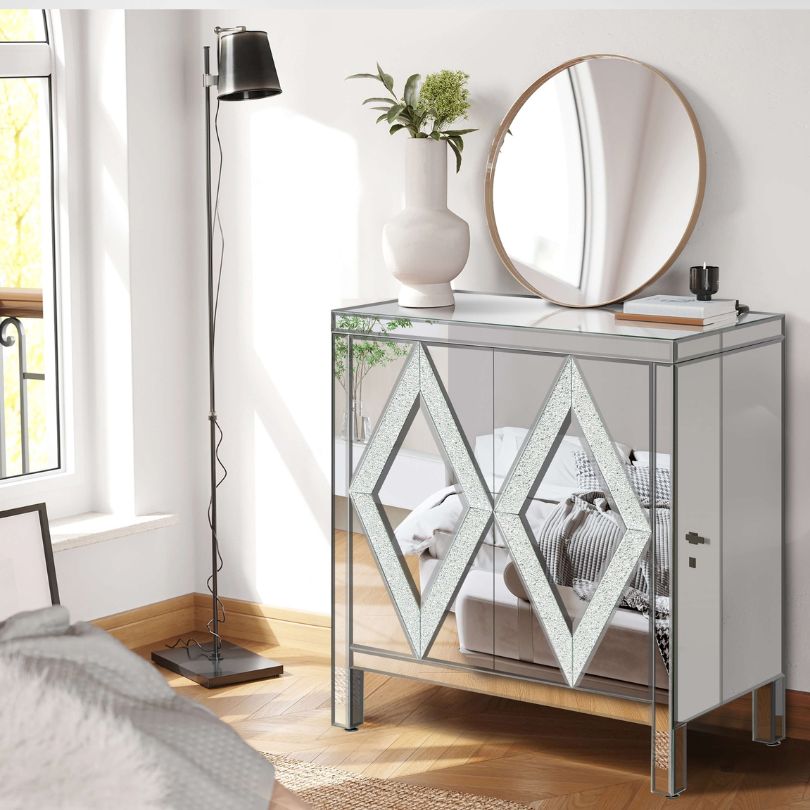 Close-up of the mirrored door of the entryway cabinet reflecting light beautifully