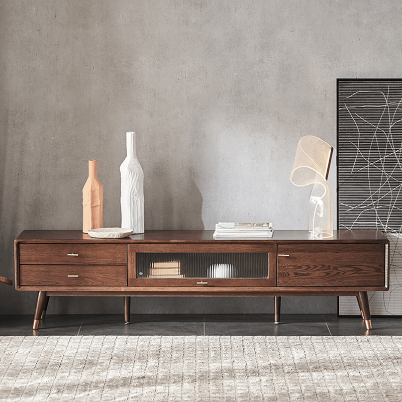 Mid-century modern walnut TV stand showcasing its ample storage space.