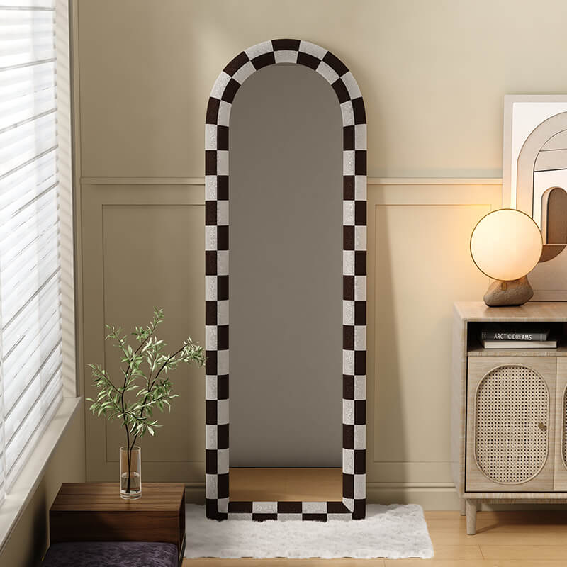 Close-up of the mirrors matte black frame and stylish white pattern backing.