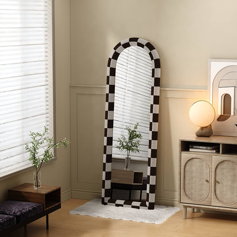 Front view of the sleek black and white floor mirror showcasing its minimalist design.